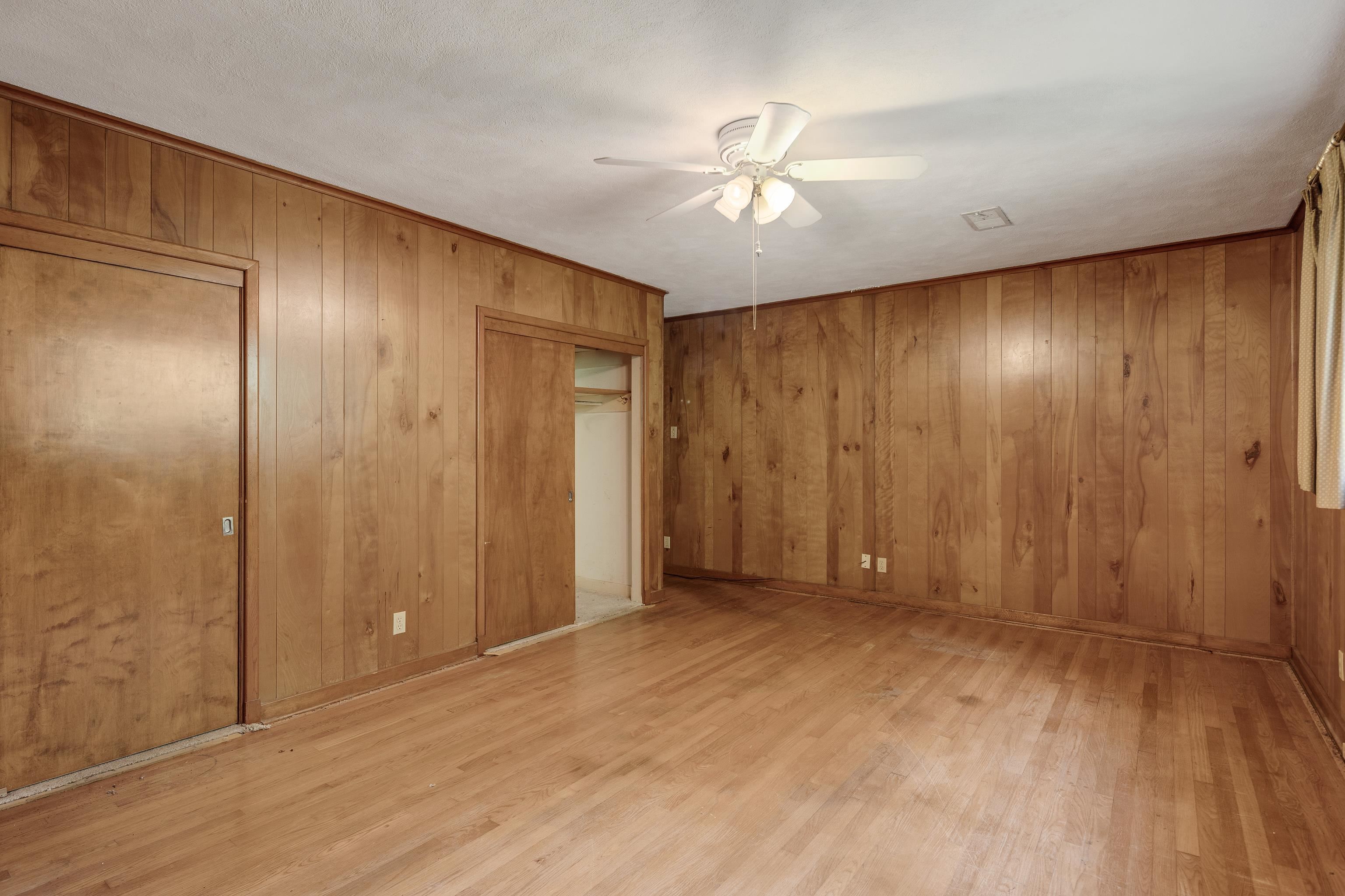4356 Tuckahoe Road Memphis, TN 38117 - Photo 19 of 25 a view of an empty room with wooden floor