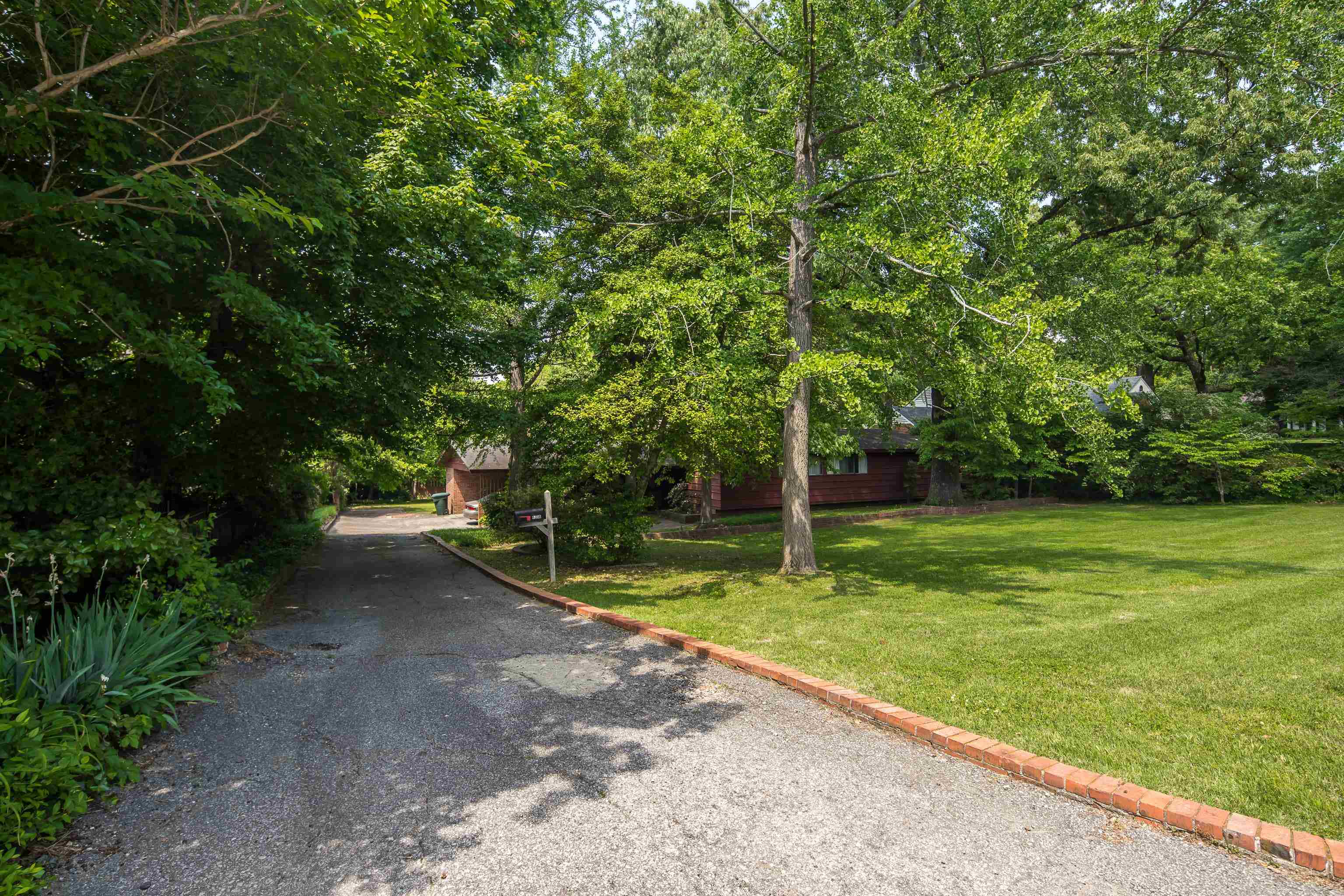 4356 Tuckahoe Road Memphis, TN 38117 - Photo 2 of 25 a view of a park with large trees