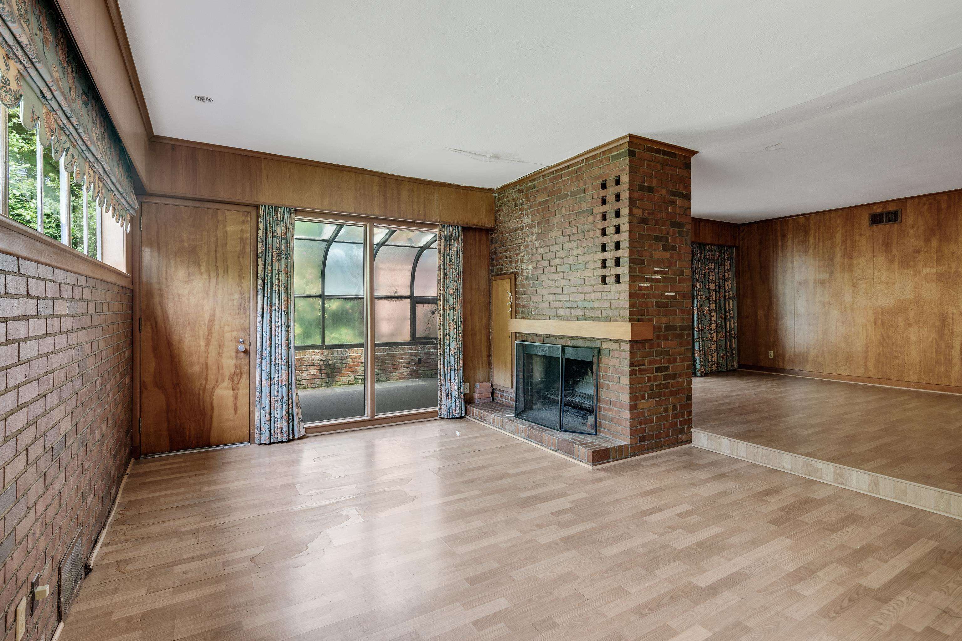 4356 Tuckahoe Road Memphis, TN 38117 - Photo 9 of 25 a view of an empty room with a fireplace and a window