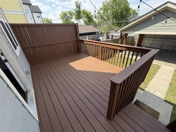 a balcony with wooden floor in outdoor space