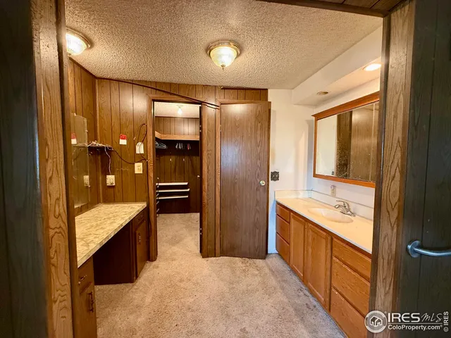 a large bathroom with a tub and shower