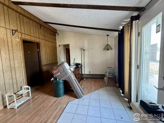 a room with wooden floor and furniture