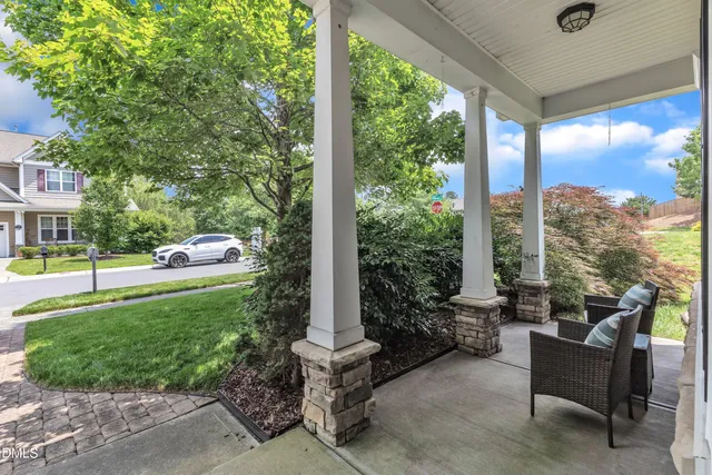 a view of a bedroom with furniture and wooden floor