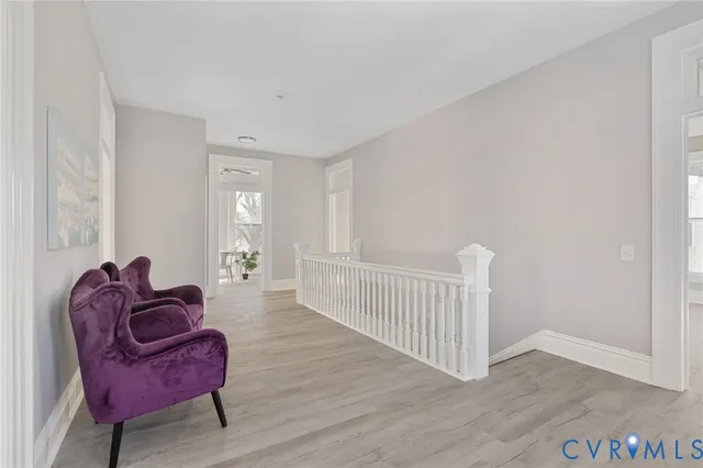 a spacious bedroom with a bed and a window