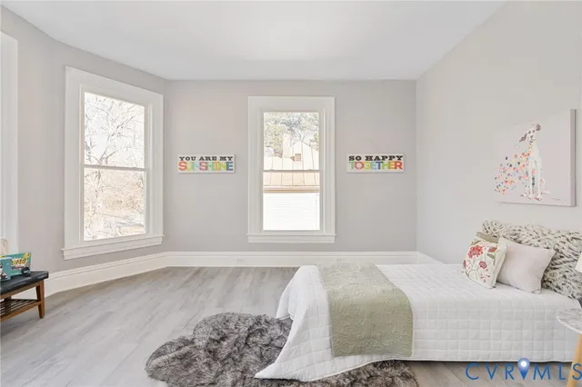a bedroom with a bed and a view of bathroom