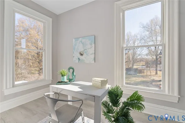 a spacious bathroom with a toilet sink and mirror