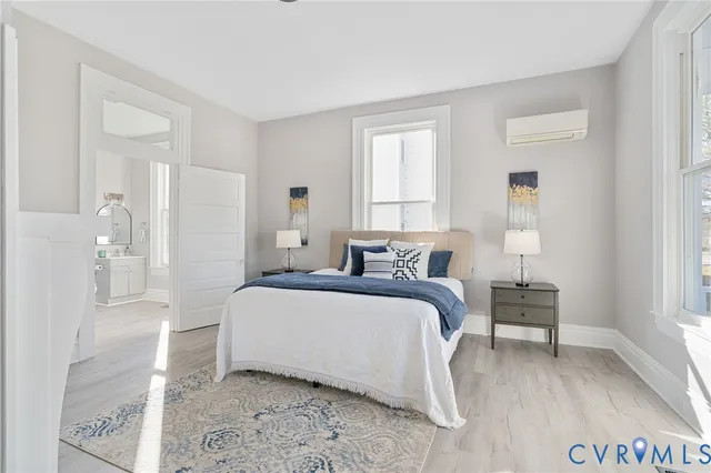 a bedroom with a bed and a fireplace