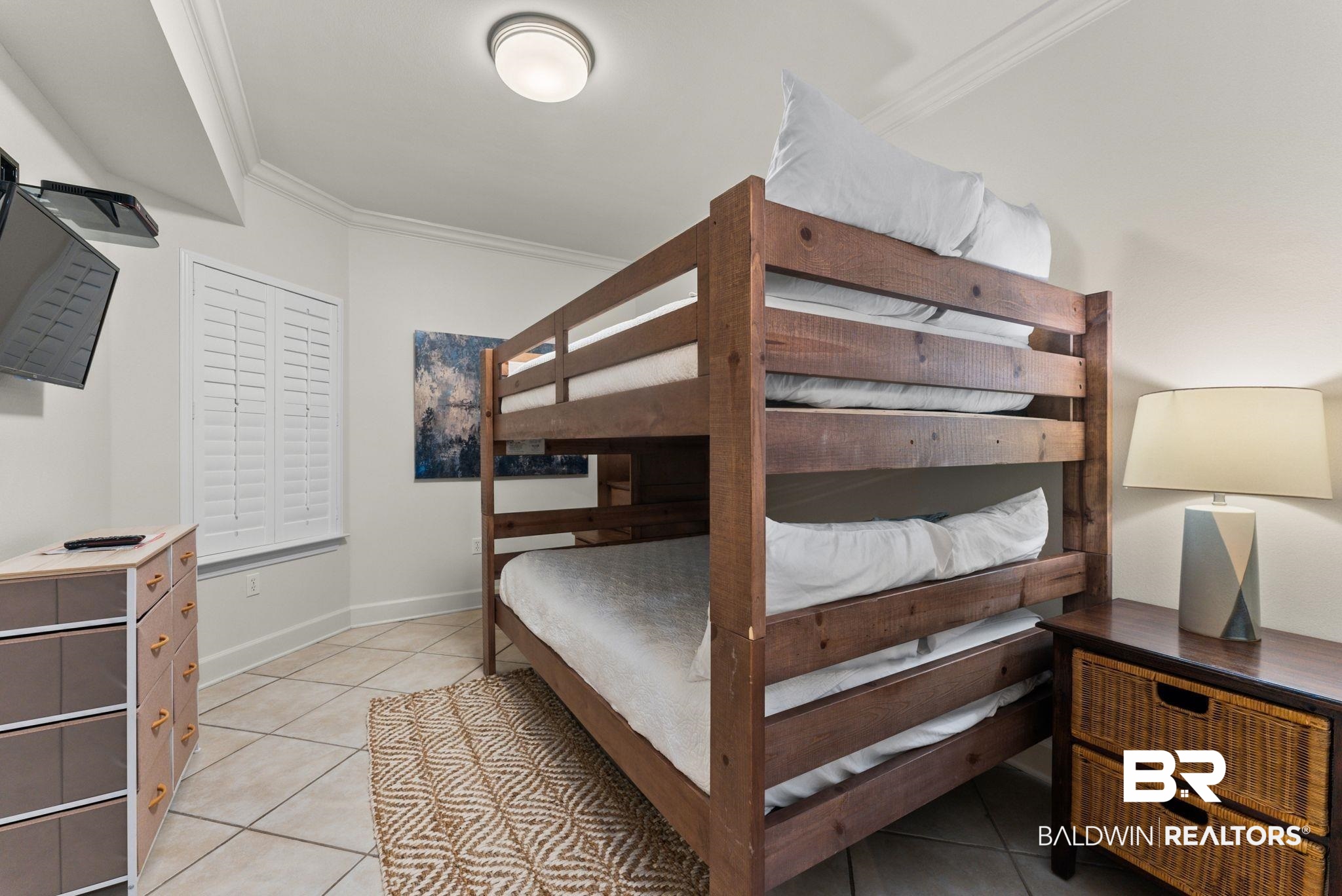27580 Canal Road, Unit 1233 Orange Beach, AL 36561 - Photo 12 of 79 Bedroom featuring light tile patterned flooring and ornamental molding