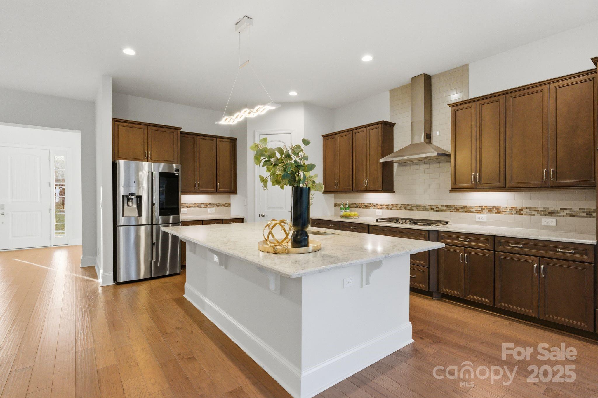 374 Hampton Trail Drive Fort Mill, SC 29708 - Photo 20 of 48 a kitchen with stainless steel appliances granite countertop a sink stove and refrigerator
