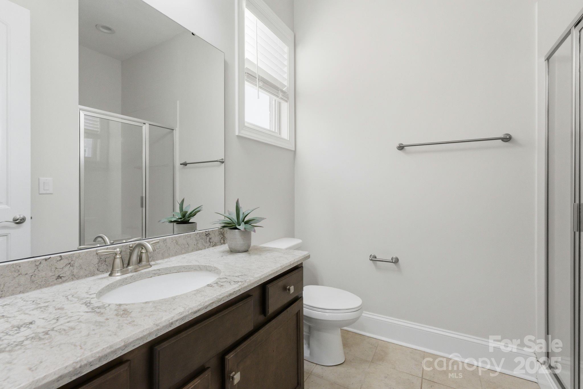 374 Hampton Trail Drive Fort Mill, SC 29708 - Photo 29 of 48 a bathroom with a granite countertop sink a toilet and a mirror