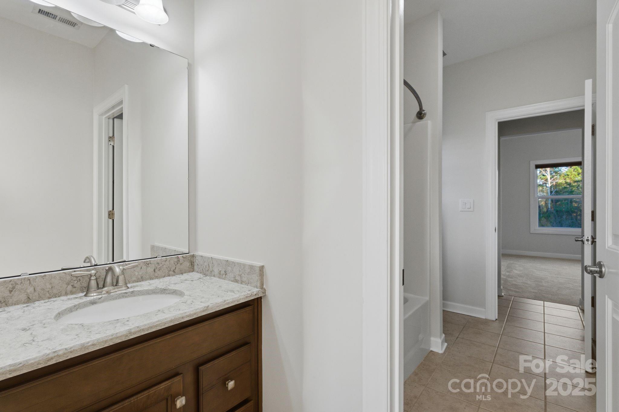374 Hampton Trail Drive Fort Mill, SC 29708 - Photo 42 of 48 a bathroom with a granite countertop sink and a mirror