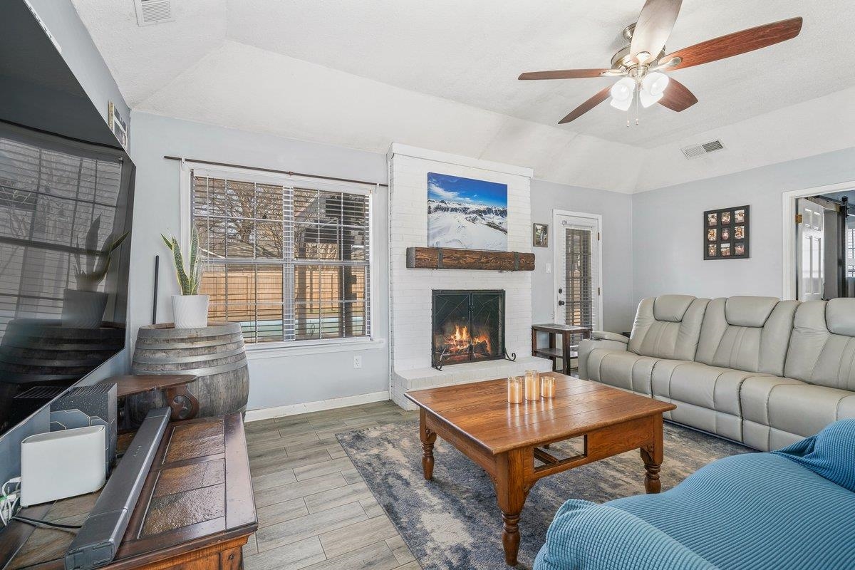 6310 Prairie View Drive Bartlett, TN 38134 - Photo 11 of 27 a living room with furniture a fireplace and a flat screen tv