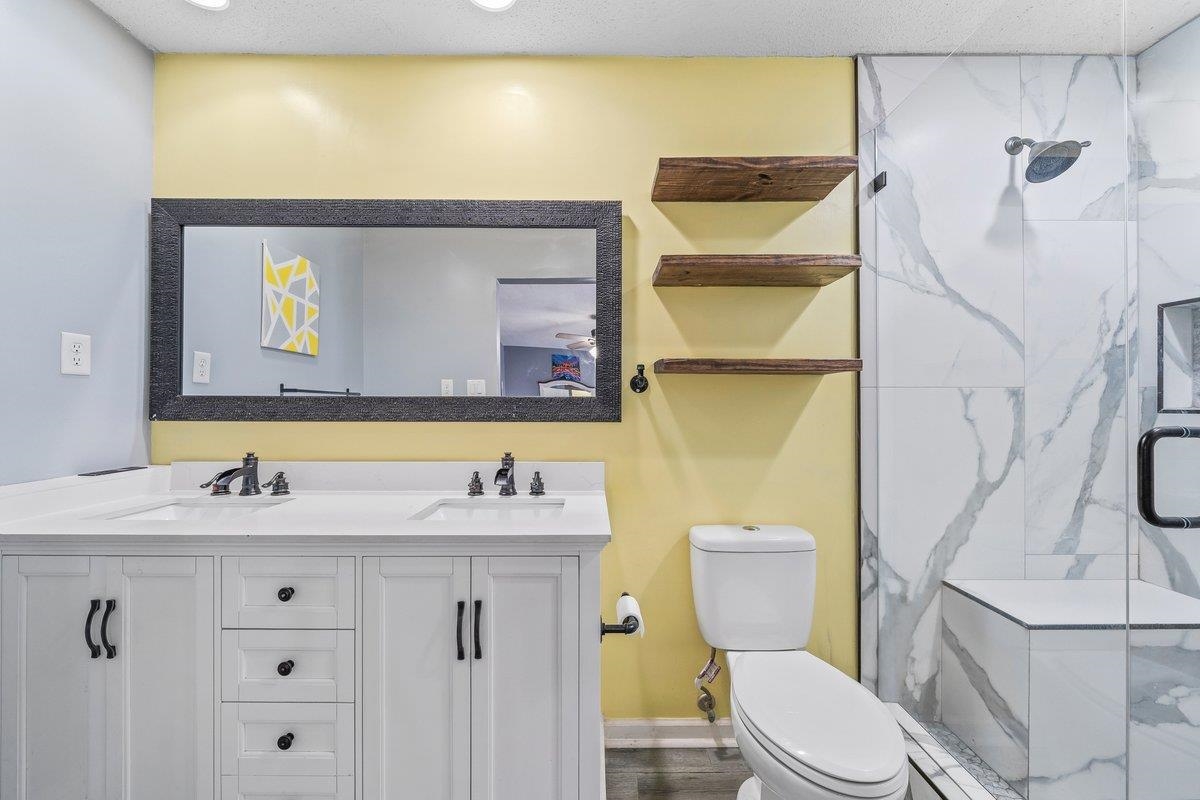 6310 Prairie View Drive Bartlett, TN 38134 - Photo 17 of 27 a bathroom with a sink mirror vanity and toilet