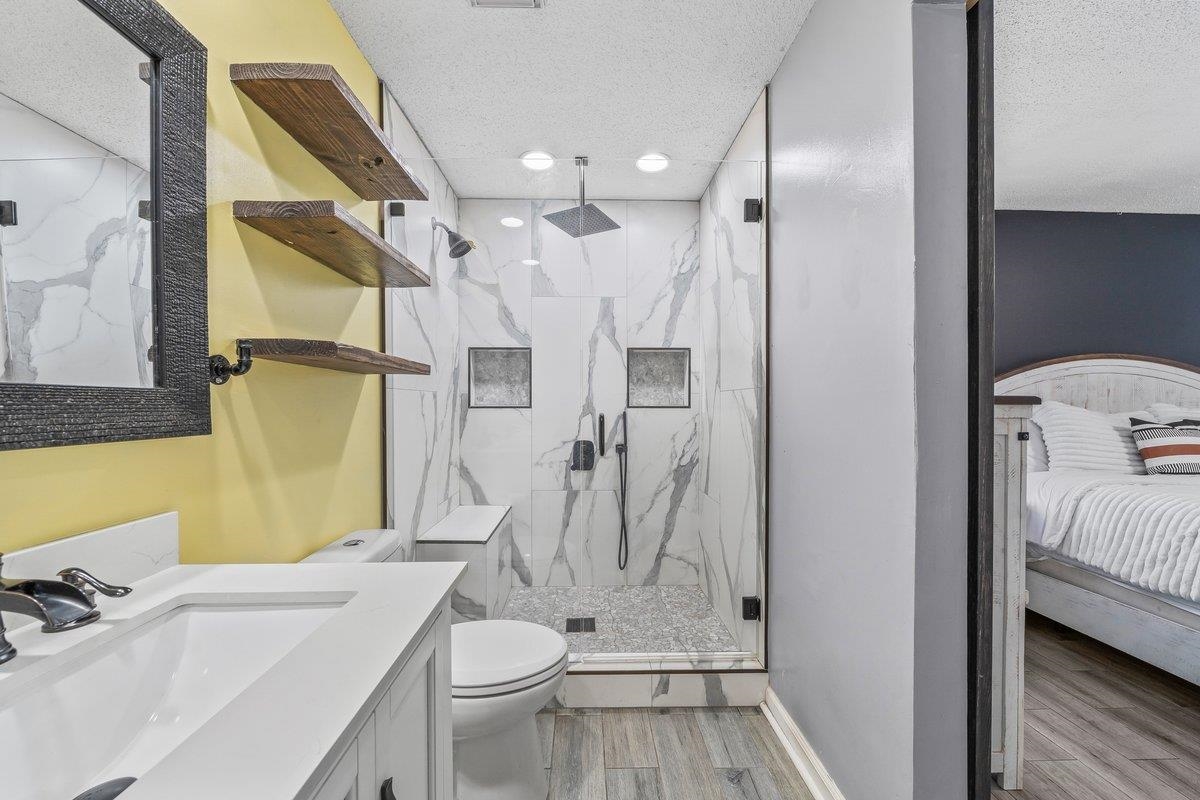 6310 Prairie View Drive Bartlett, TN 38134 - Photo 18 of 27 a bathroom with a sink toilet and shower