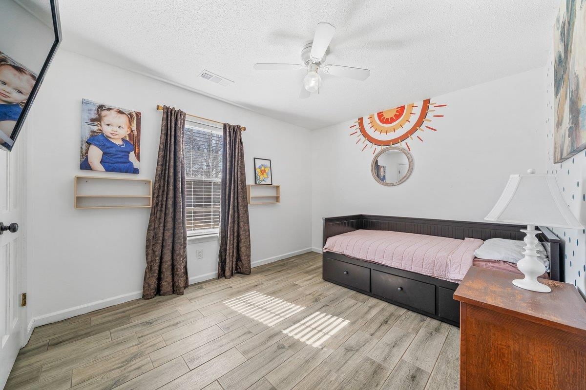 6310 Prairie View Drive Bartlett, TN 38134 - Photo 20 of 27 a bedroom with a bed and painting on the wall