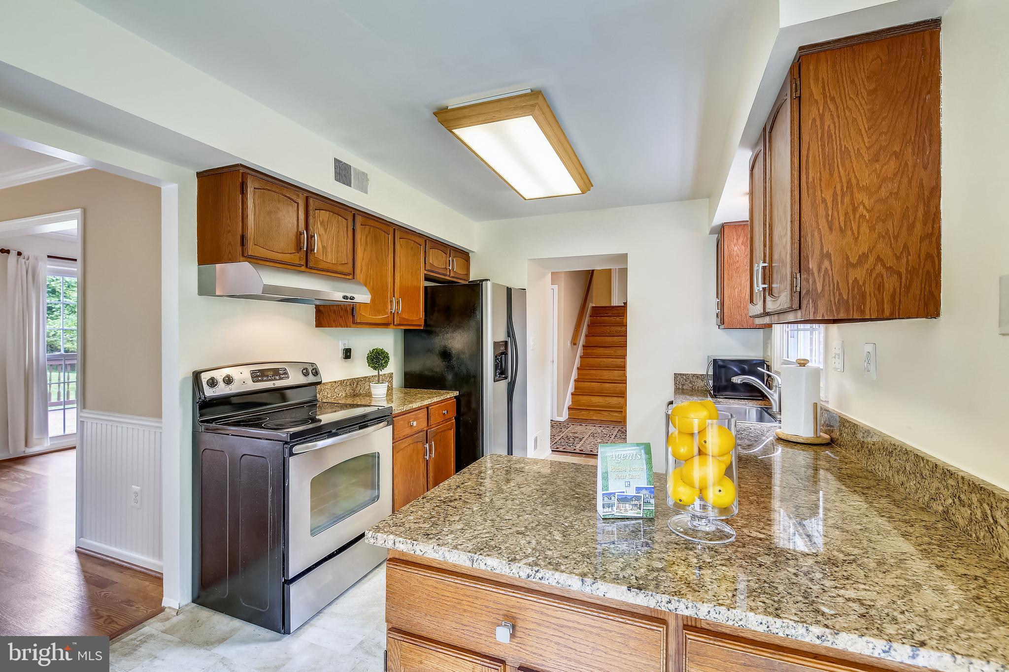 2417 Nees Lane Silver Spring, MD 20905 - Photo 14 of 65 Granite counters & stainless steel appliances