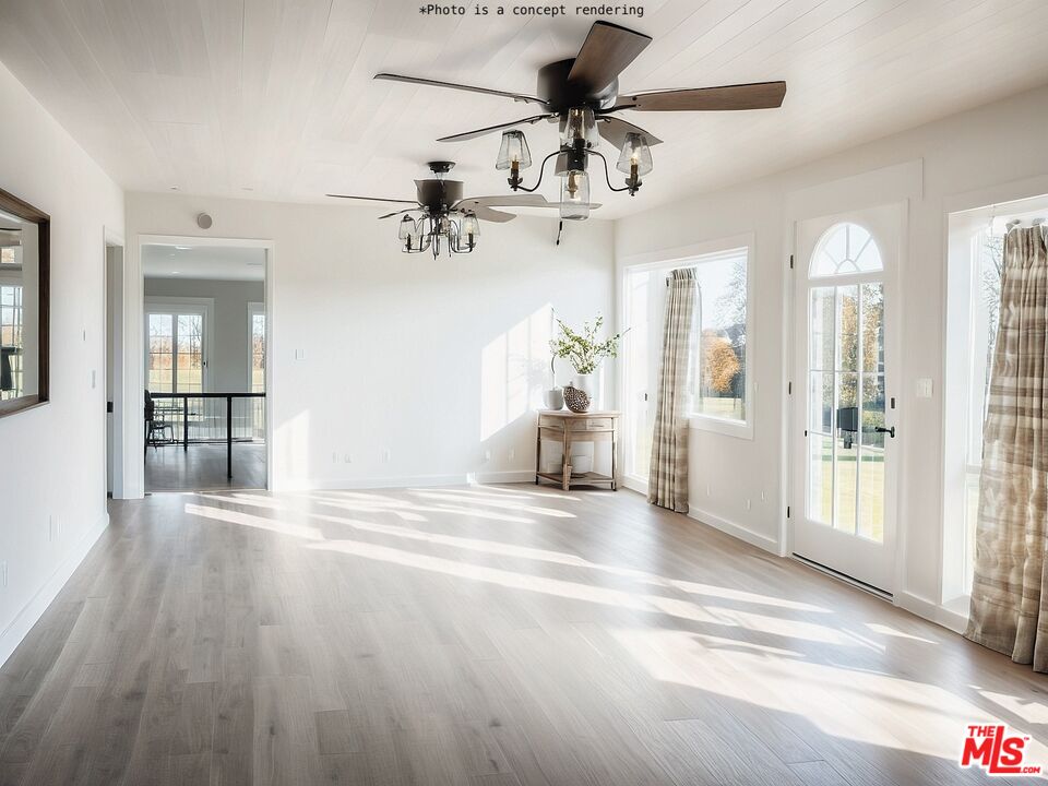 618 Wisner Road Mount Shasta, CA 96067 - Photo 2 of 21 a view of a livingroom with wooden floor and a ceiling fan