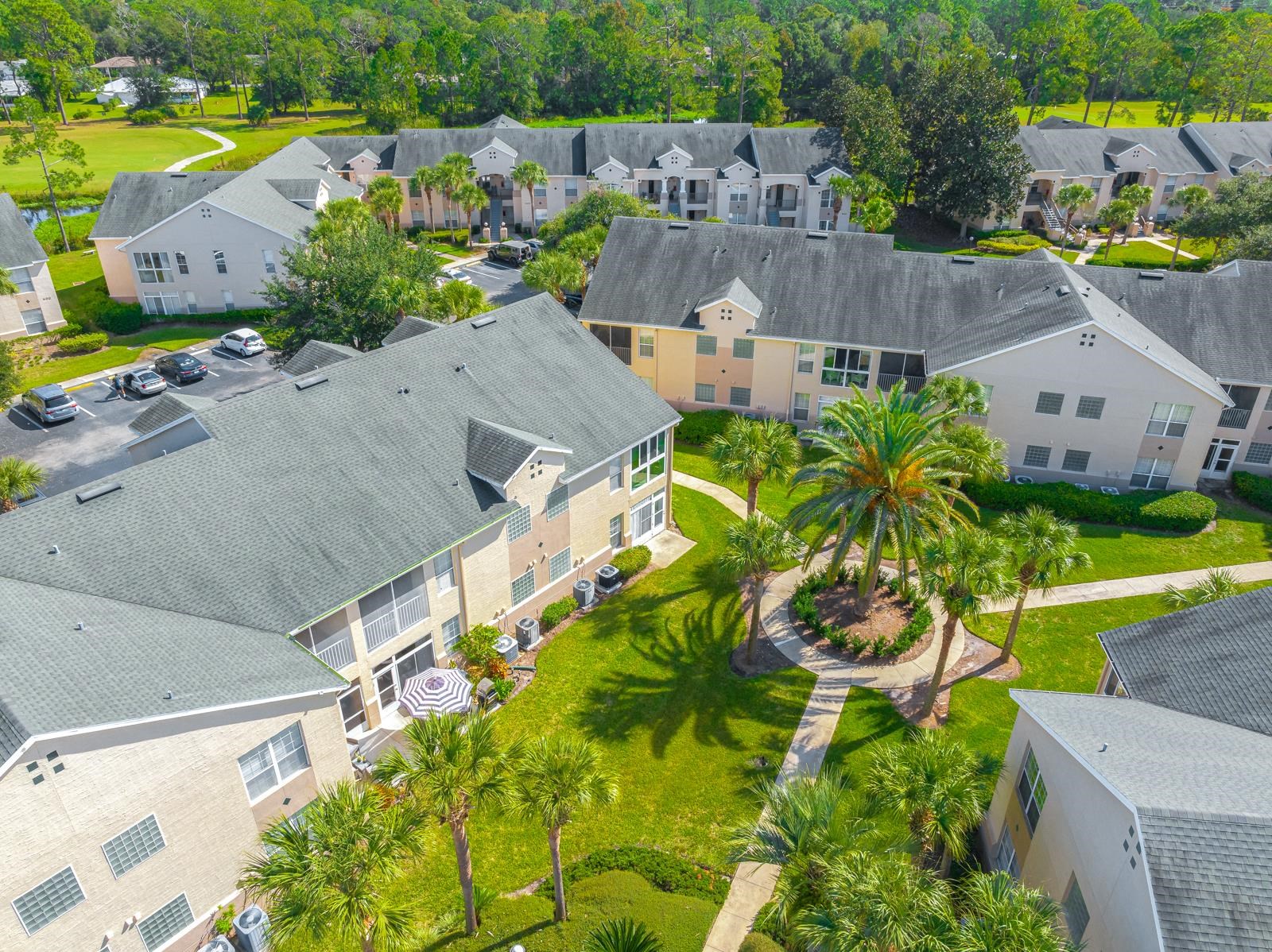 500 Augusta Circle St. Augustine, FL 32086 - Photo 26 of 39 an aerial view of a house with a garden and yard