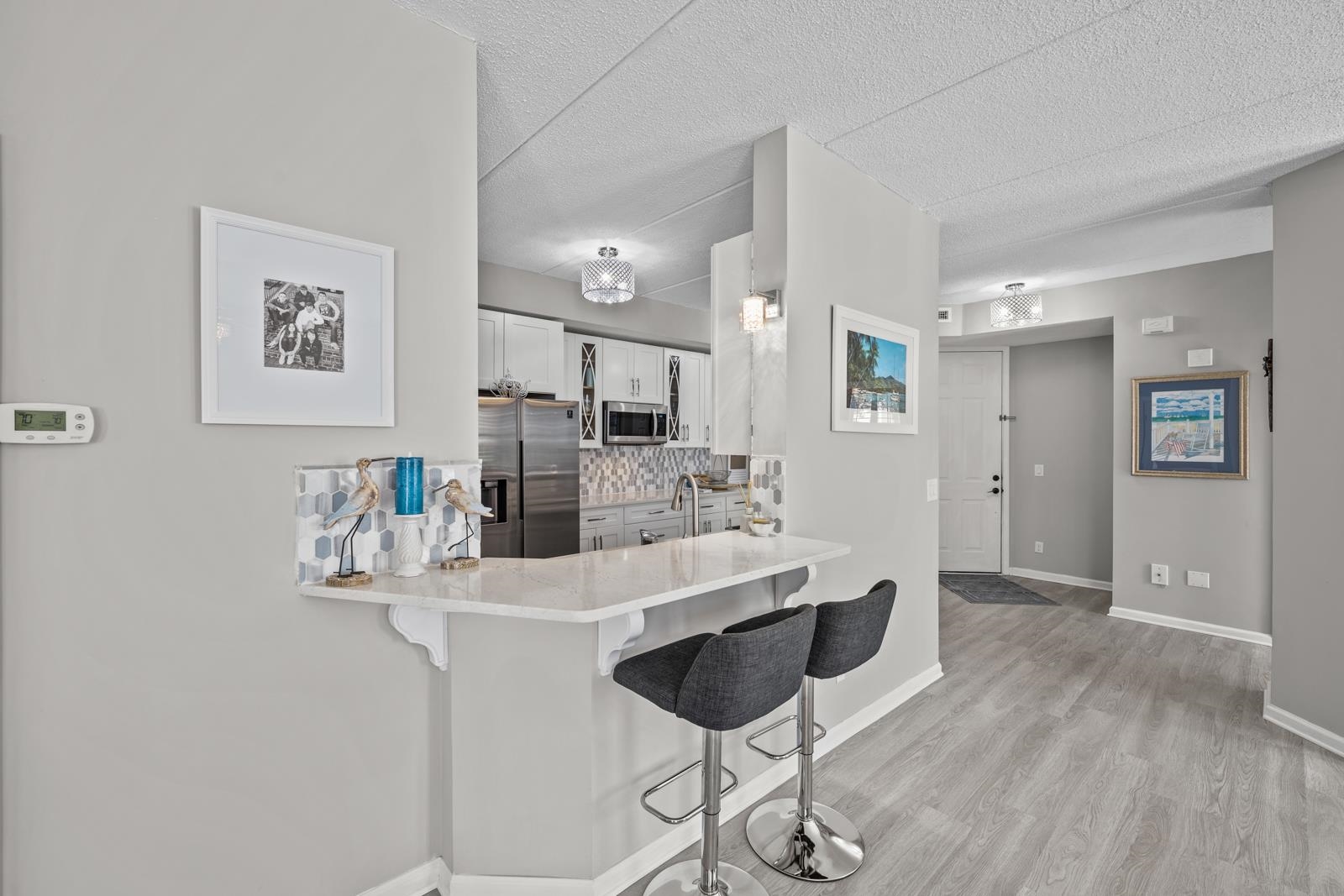 500 Augusta Circle St. Augustine, FL 32086 - Photo 3 of 39 a kitchen with a refrigerator and cabinets
