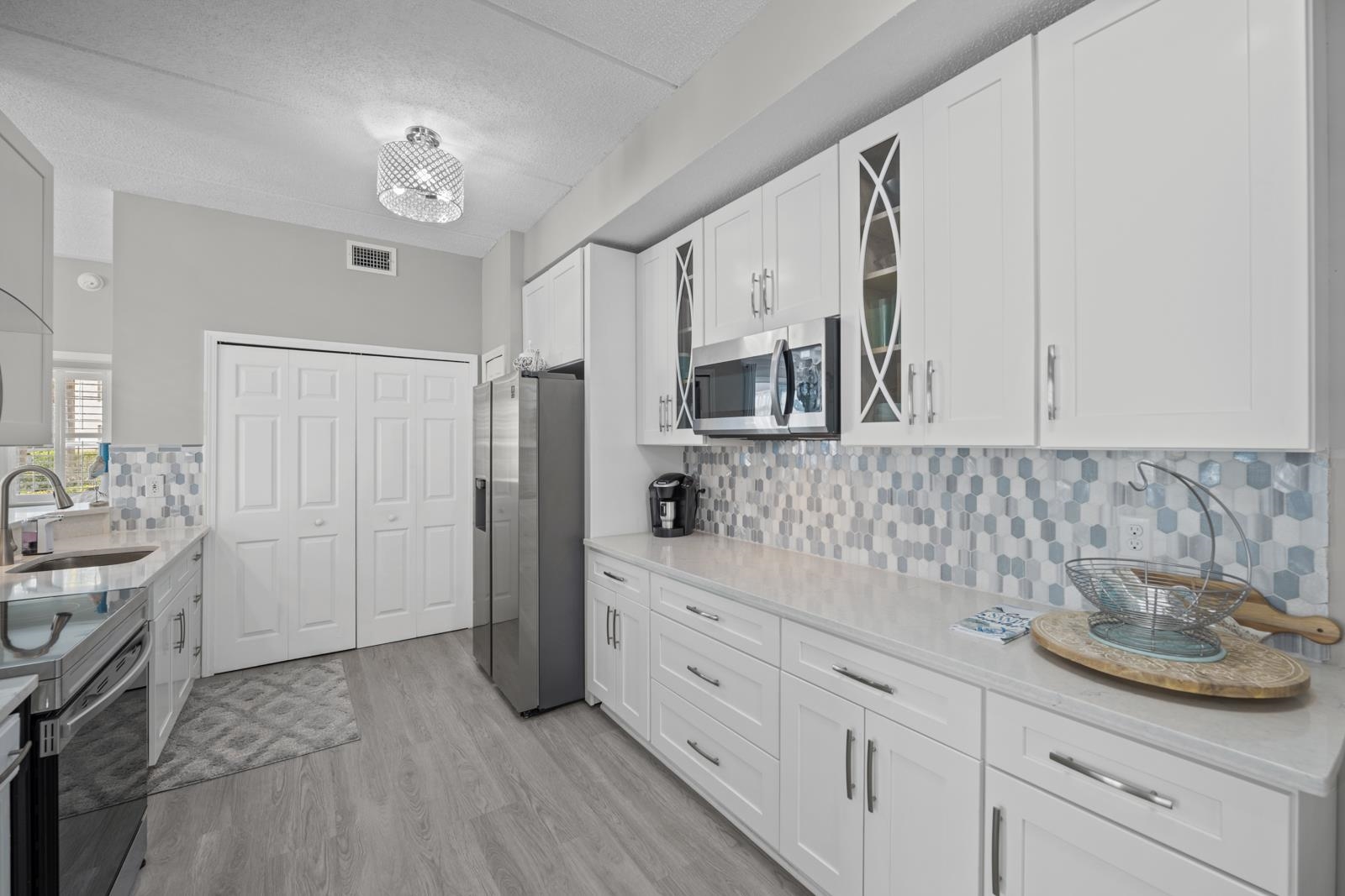 500 Augusta Circle St. Augustine, FL 32086 - Photo 5 of 39 a room with white cabinets and sink