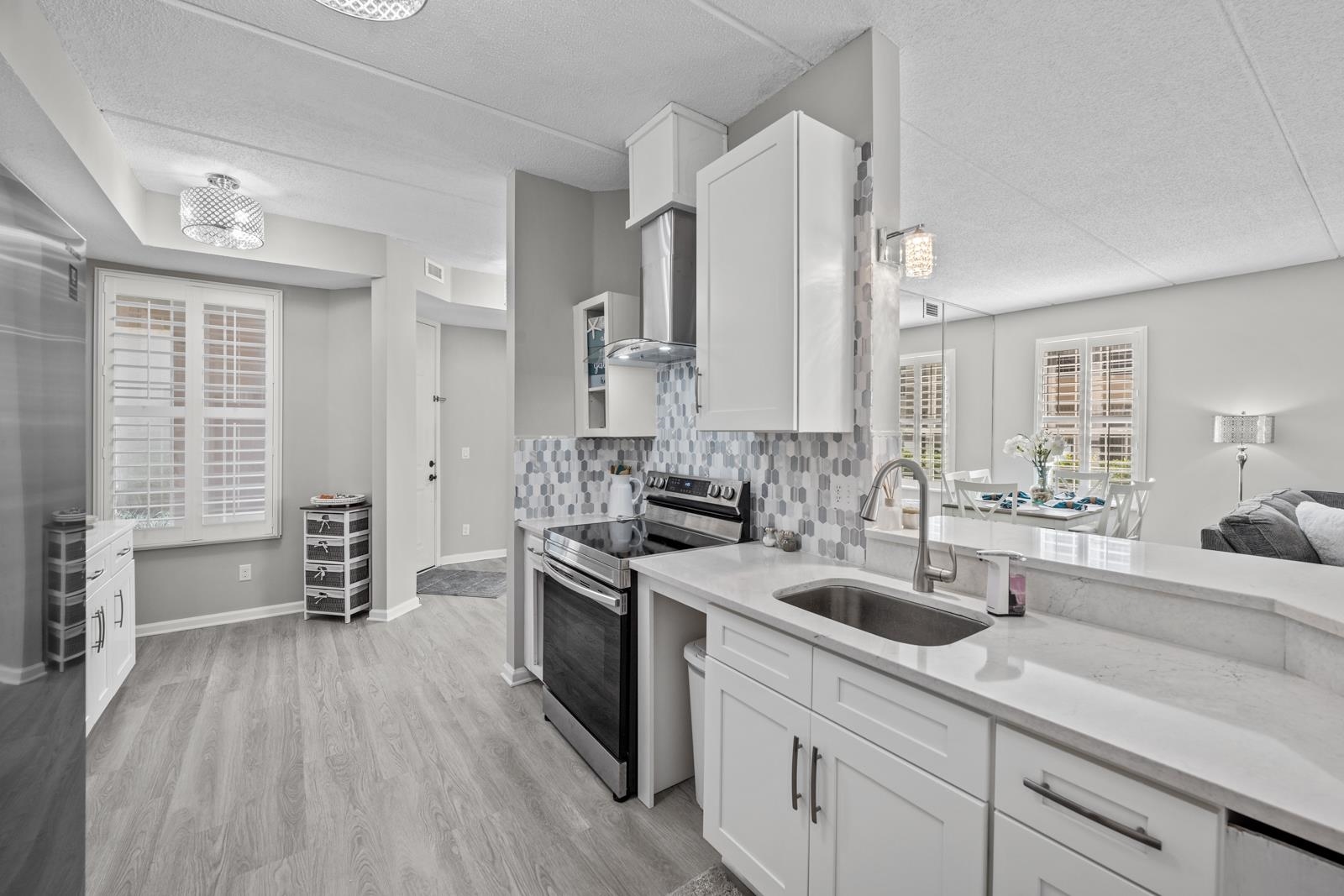500 Augusta Circle St. Augustine, FL 32086 - Photo 6 of 39 a kitchen with a sink a stove and cabinets