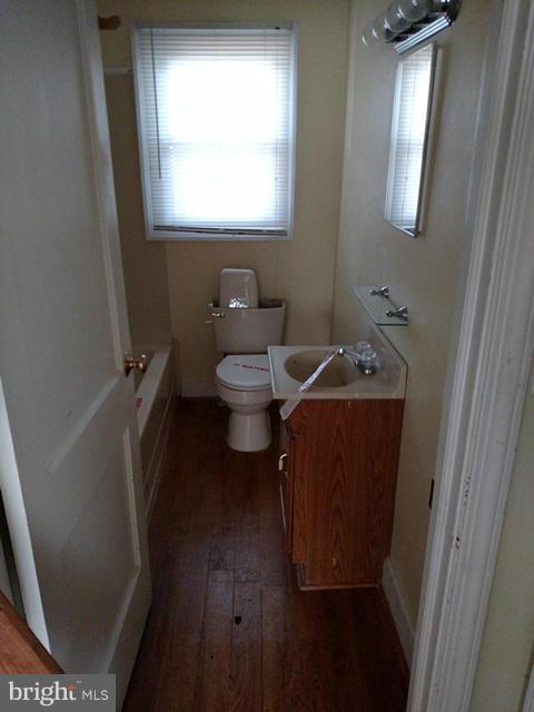 6173 Bethlehem Road Preston, MD 21655 - Photo 6 of 8 a bathroom with a toilet and a sink