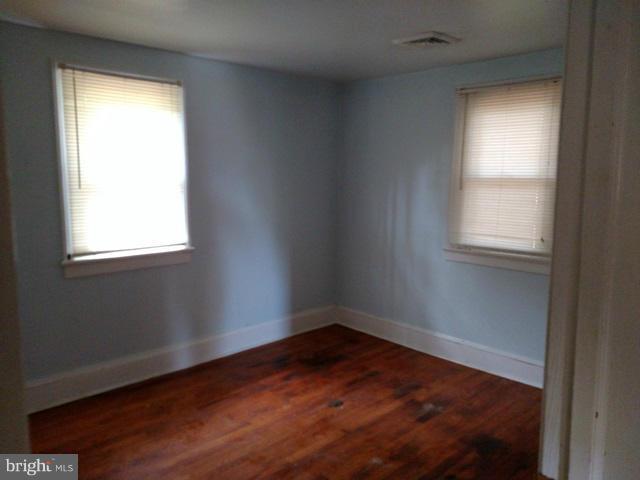 6173 Bethlehem Road Preston, MD 21655 - Photo 7 of 8 an empty room with a window