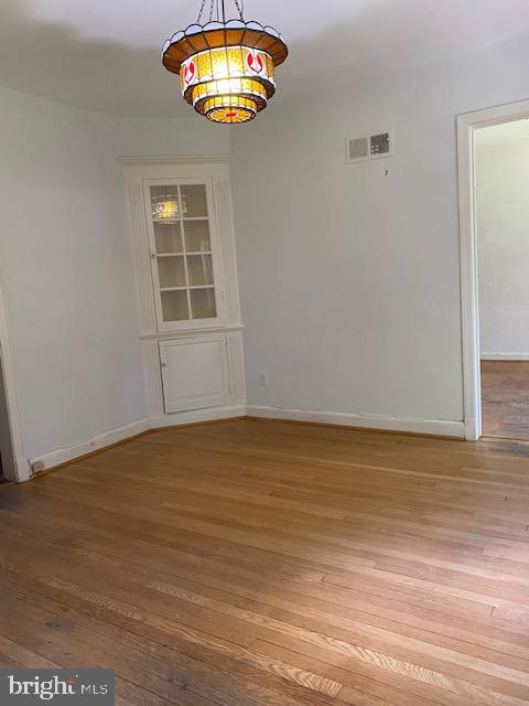 5707 Harwick Road Bethesda, MD 20816 - Photo 6 of 32 Formal dining room with built-in corner hutch.