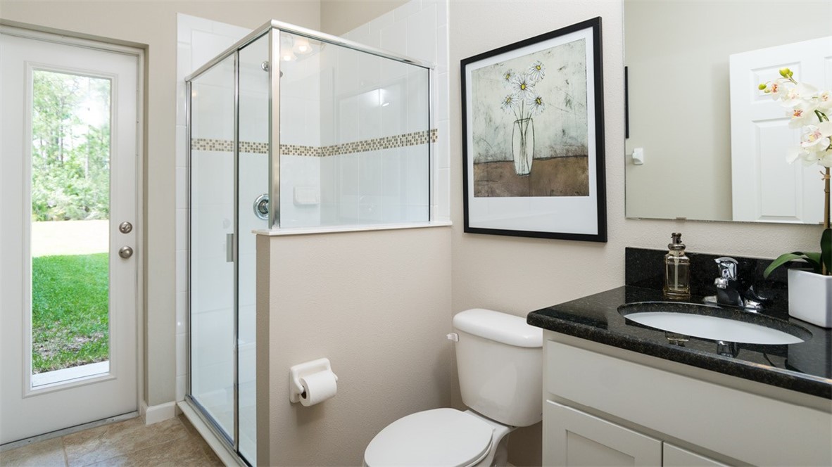 94 52nd Square Vero Beach, FL 32968 - Photo 11 of 20 a bathroom with a granite countertop sink toilet and mirror
