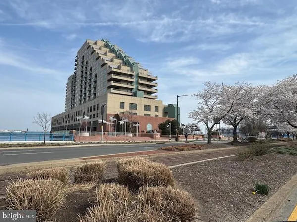 a view of a large building next to a road