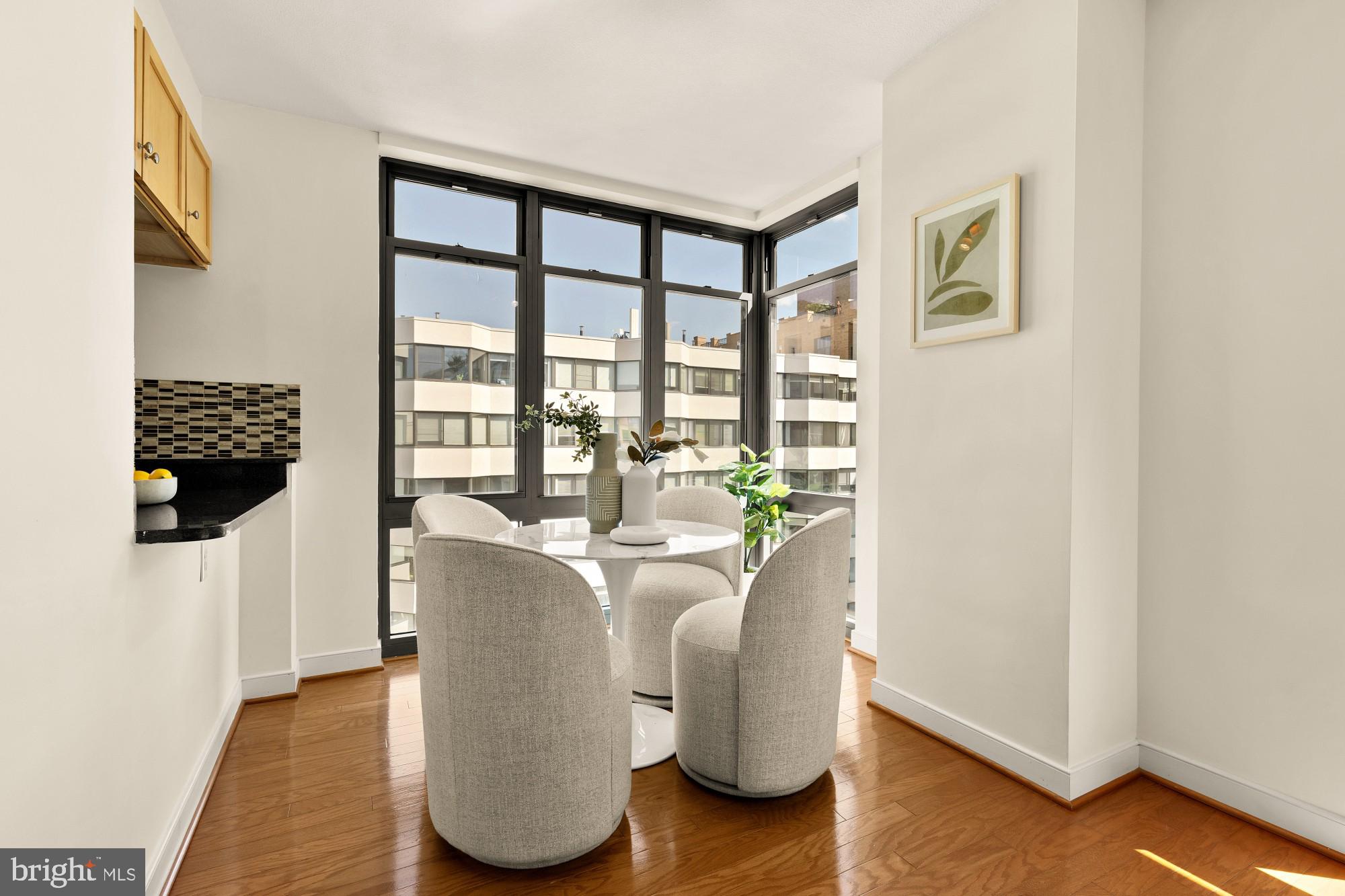 1117 10th Street Northwest, Unit 908 Washington, DC 20001 - Photo 6 of 19 a living room with furniture and a window