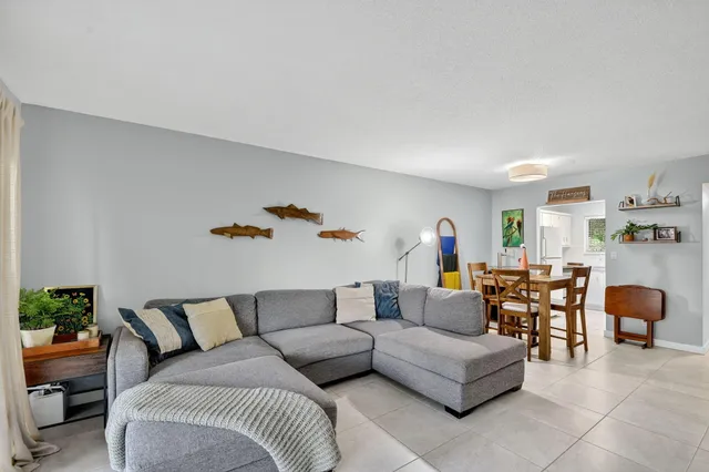 a bed room with a bed and a large window