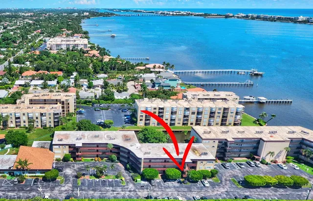 an aerial view of a house with a lake view