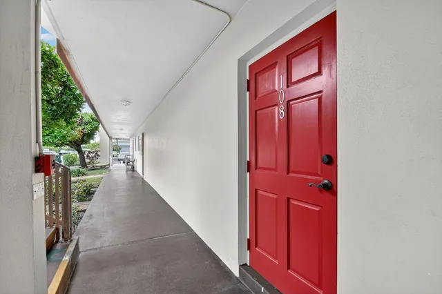 a white refrigerator freezer and a stove sitting inside of a kitchen