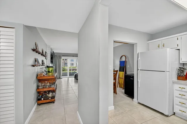 a kitchen with stainless steel appliances and white cabinets