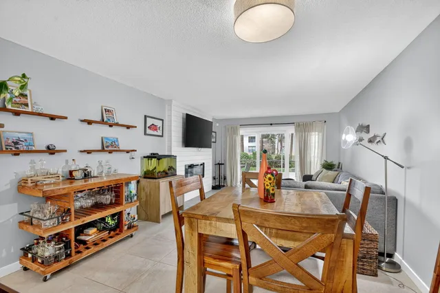 a living room with furniture tv and a fireplace
