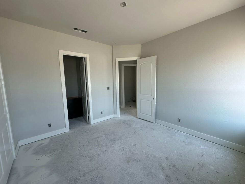 295 Brown Road Leonard, TX 75452 - Photo 16 of 26 Interior room featuring light gray painted walls with white baseboards and trim