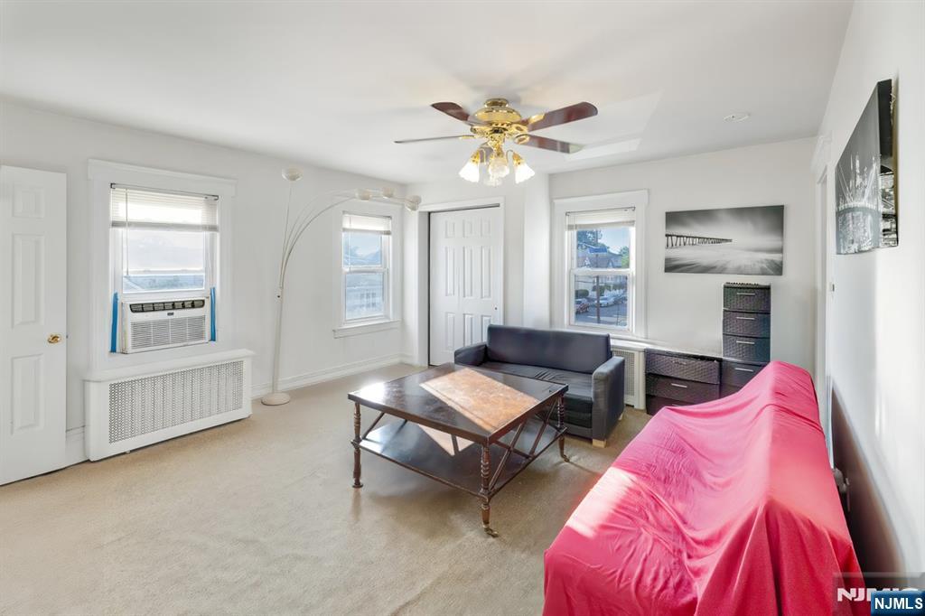 418 Taylor Avenue Hackensack, NJ 07601 - Photo 22 of 48 a living room with furniture and a window