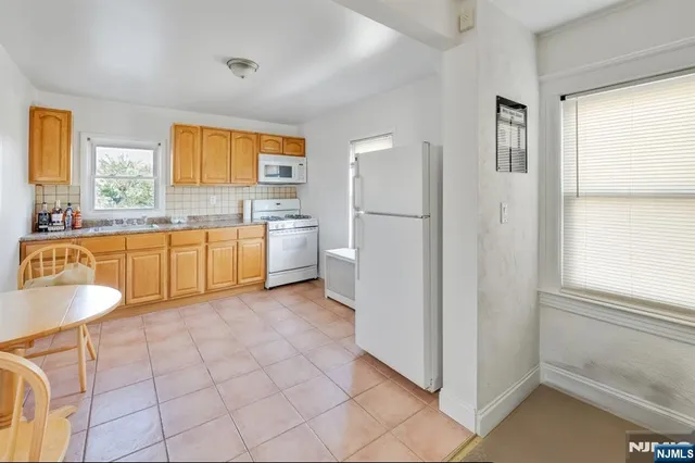 a view of an empty room with stairs