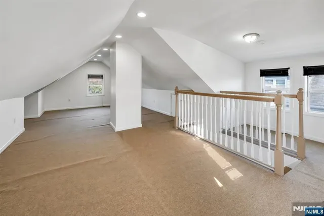 a view of a storage and utility room with washer and dryer