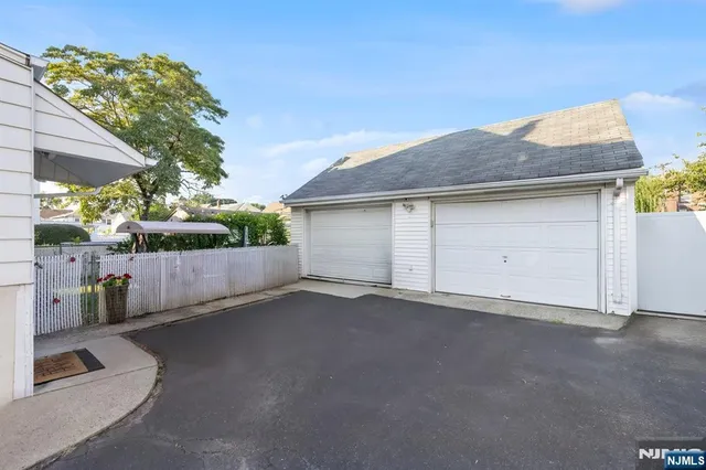 a view of a house with swimming pool and sitting area