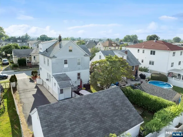 an aerial view of a house with a garden and plants