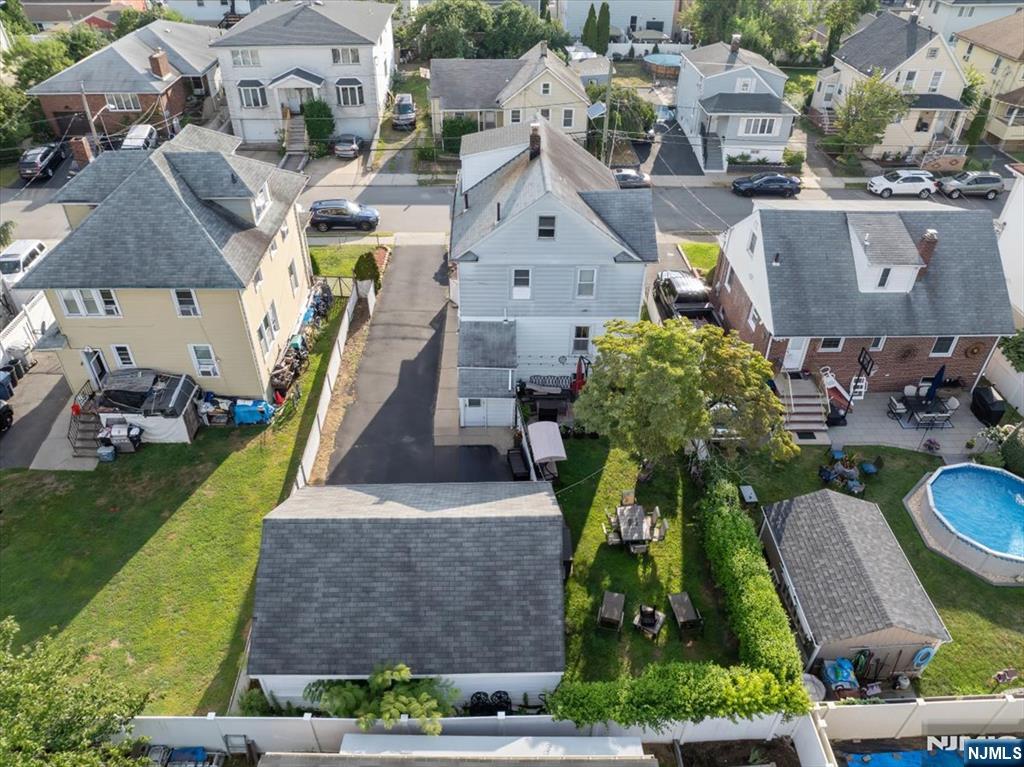 418 Taylor Avenue Hackensack, NJ 07601 - Photo 39 of 48 an aerial view of a house with a garden and plants