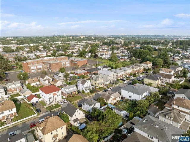 an aerial view of a house with outdoor space