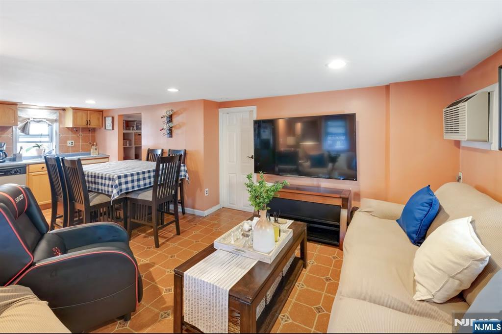 418 Taylor Avenue Hackensack, NJ 07601 - Photo 5 of 48 a living room with furniture and a flat screen tv