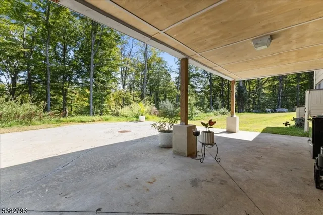a view of swimming pool with a patio