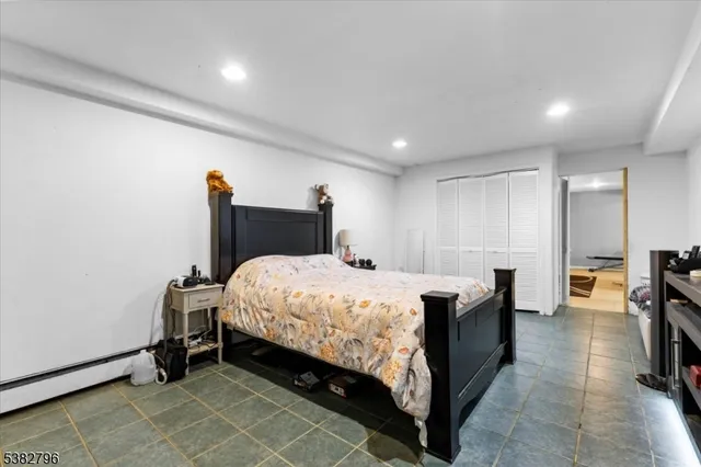 a bed room with a bed and a chair