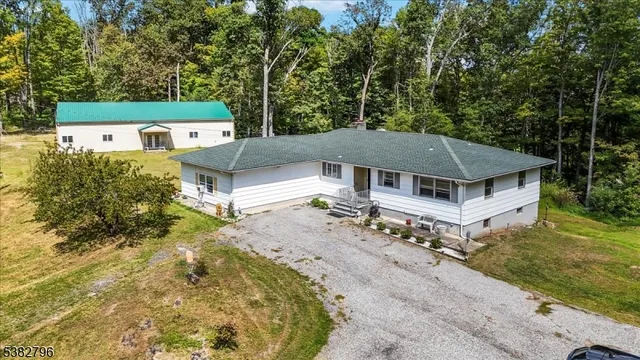 aerial view of a house with a yard