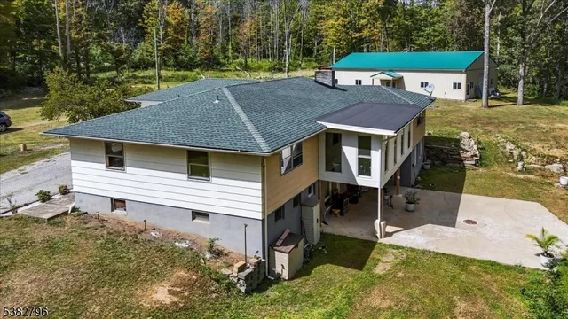 a aerial view of a house with a yard