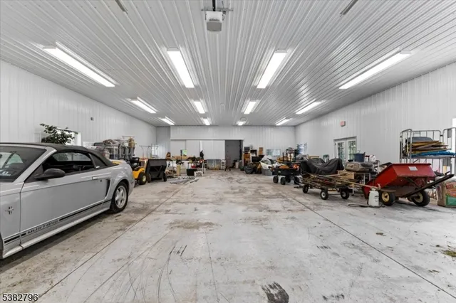a group of cars parked in a parking room